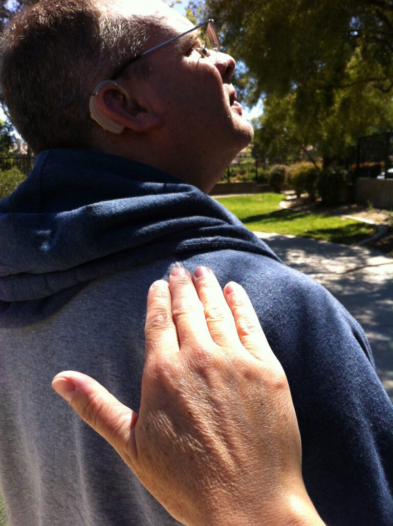 get a deaf person's attention. tapping shoulder