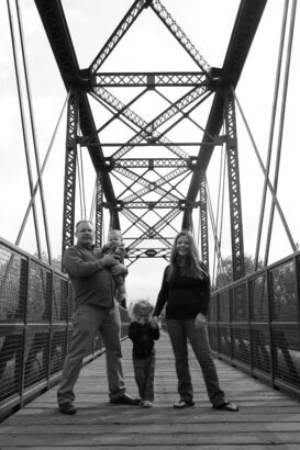 JenLeora and her family on a bridge